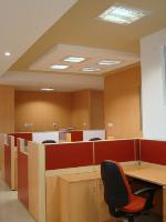 the main theme has been done with light coloured wood grain laminate with colourful accents  in the partitions and ceiling.